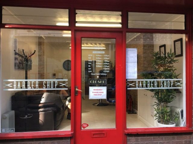 The red door and Barber Shop windows